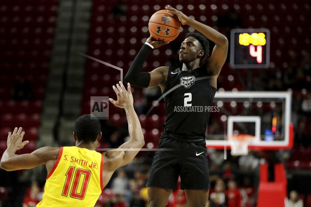 Julio Cortez Oakland guard Tray Maddox Jr. (2) shoots over Maryland guard Serrel Smith Jr. (10) during the first half of an NCAA college basketball game, Saturday, Nov. 16, 2019, in College Park, Md. (AP Photo/Julio Cortez)