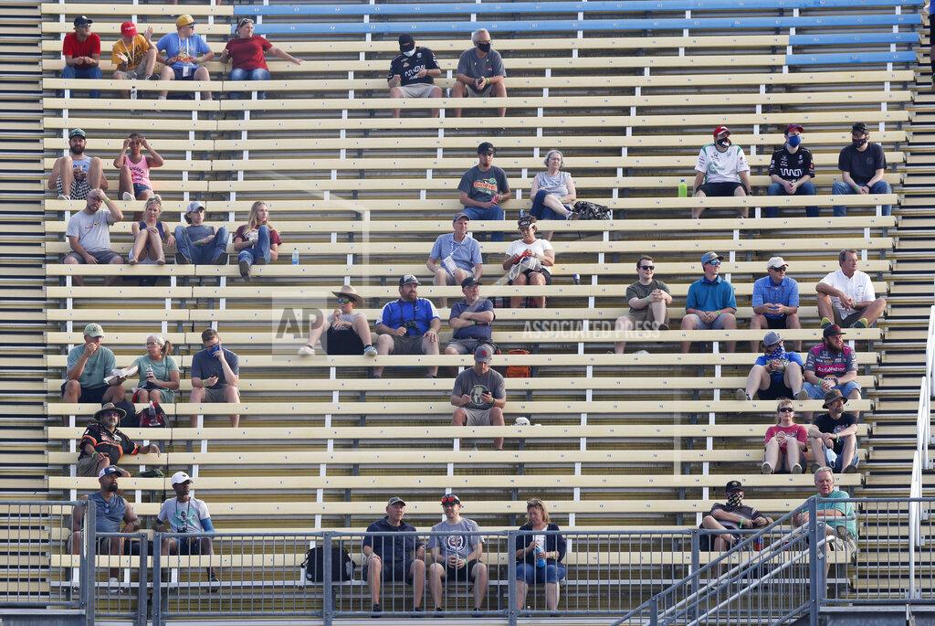 Charlie Neibergall Fans sit in spread out groups as they watch the IndyCar Series auto race Friday, July 17, 2020, at Iowa Speedway in Newton, Iowa. (AP Photo/Charlie Neibergall)