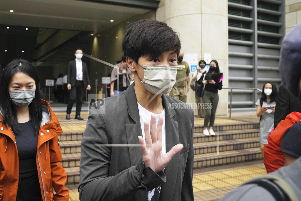 Kin Cheung Hong Kong singer Denise Ho leaves after an appearance at a court in Hong Kong as he was charged in relation to their past fundraising for activists, Tuesday, May 24, 2022. (AP Photo/Kin Cheung)