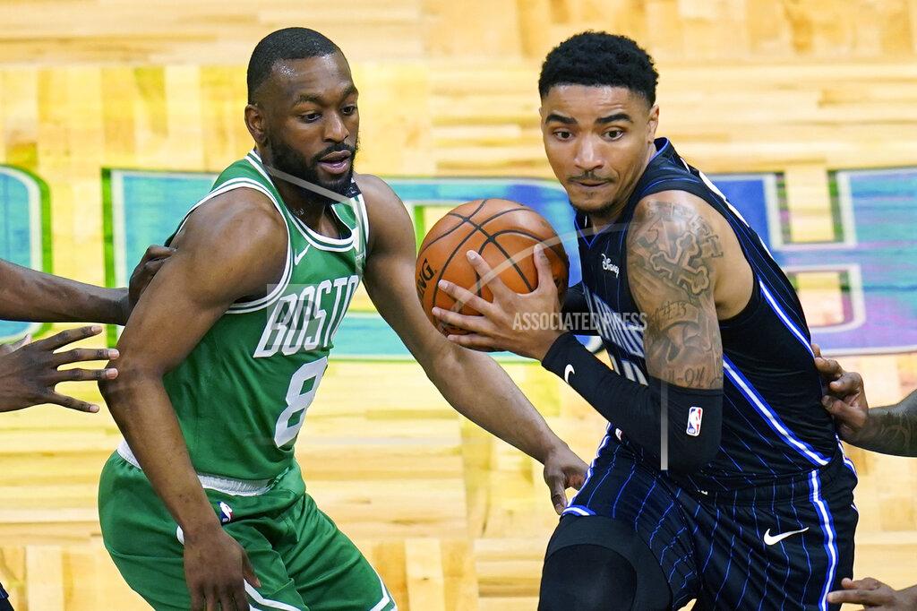 John Raoux Orlando Magic guard Gary Harris, right, makes a move to get past Boston Celtics guard Kemba Walker (8) during the first half of an NBA basketball game, Wednesday, May 5, 2021, in Orlando, Fla. (AP Photo/John Raoux)