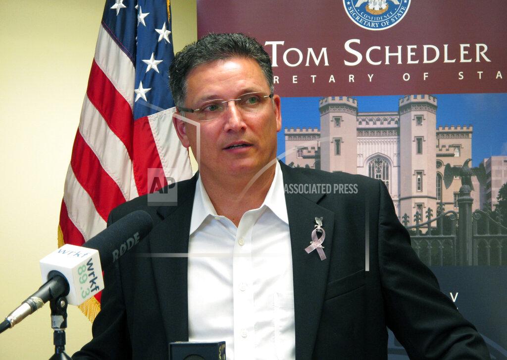 FILE - In this July 12, 2017 file photo, former state Rep. John Schroder, R-Covington, speaks after completing his paperwork to run for state treasurer, in Baton Rouge, La. Louisiana's State Treasurer Schroder says some small businesses harmed by the coronavirus pandemic should start seeing grants from a $300 million federally financed program as soon as next month. The money is part of $1.8 billion in direct congressional relief that Louisiana received to respond to COVID-19. Schroder told lawmakers Monday, June 22, 2020, that he hopes to have distributed all of the aid over a few months. (AP Photo/Melinda Deslatte, File)