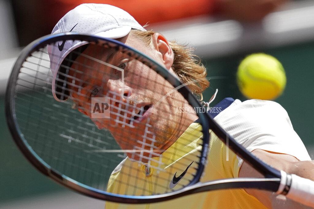 Christophe Ena Canada's Denis Shapovalov plays a shot against Denmark's Holger Rune during their first round match at the French Open tennis tournament in Roland Garros stadium in Paris, France, Tuesday, May 24, 2022. (AP Photo/Christophe Ena)