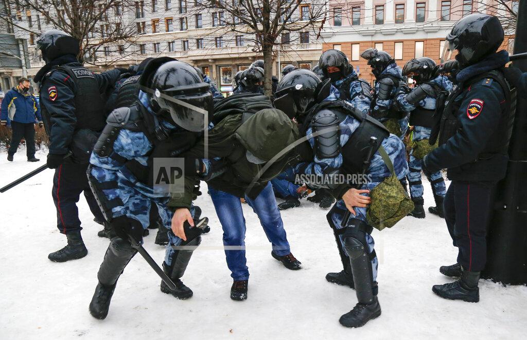 Alexander Zemlianichenko Police detain a man during a protest against the jailing of opposition leader Alexei Navalny in Moscow, Russia, Saturday, Jan. 23, 2021. Russian police on Saturday arrested hundreds of protesters who took to the streets in temperatures as low as minus-50 C (minus-58 F) to demand the release of Alexei Navalny, the country's top opposition figure. A Navalny, President Vladimir Putin's most prominent foe, was arrested on Jan. 17 when he returned to Moscow from Germany, where he had spent five months recovering from a severe nerve-agent poisoning that he blames on the Kremlin. (AP Photo/Alexander Zemlianichenko)