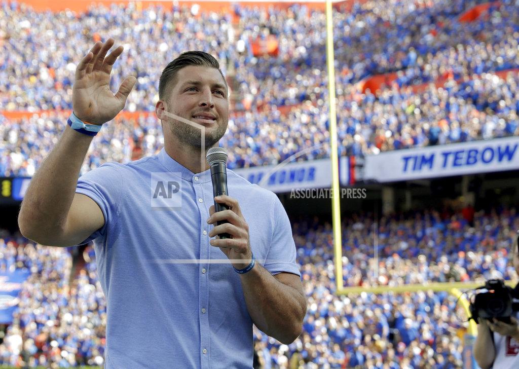 John Raoux Former Florida football player Tim Tebow speaks to fans after he was inducted in the Ring of Honor at Florida Field during the first half of an NCAA college football game against LSU, Saturday, Oct. 6, 2018, in Gainesville, Fla. (AP Photo/John Raoux)