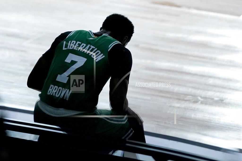 Ashley Landis Boston Celtics' Jaylen Brown sits on a side board after committing a foul against the Toronto Raptors during the first half of an NBA basketball game Friday, Aug. 7, 2020 in Lake Buena Vista, Fla. (AP Photo/Ashley Landis, Pool)