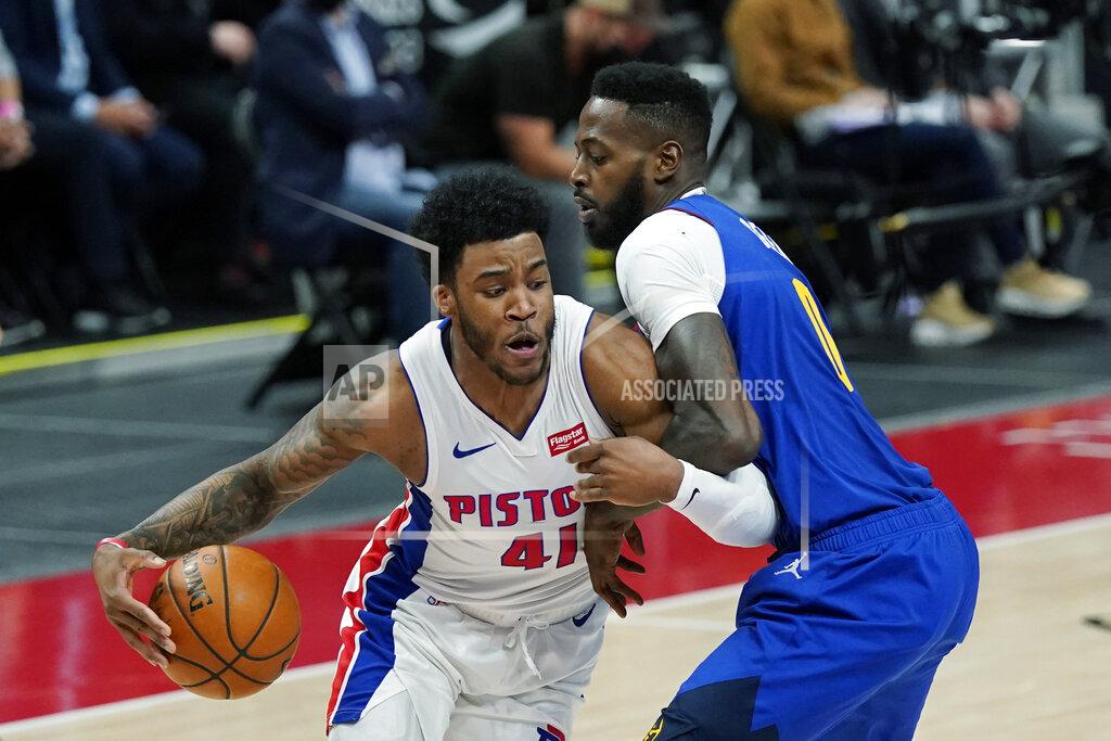 Carlos Osorio Detroit Pistons forward Saddiq Bey (41) is defended by Denver Nuggets forward JaMychal Green during the second half of an NBA basketball game, Friday, May 14, 2021, in Detroit. (AP Photo/Carlos Osorio)