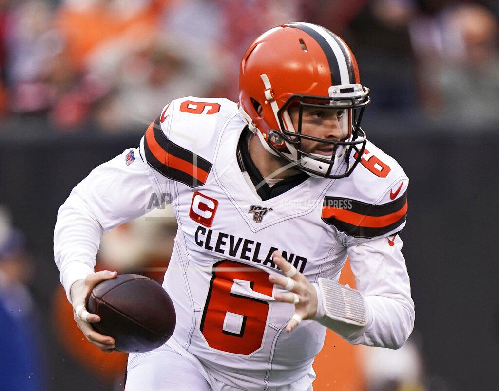 Bryan Woolston In this Dec. 29, 2019, photo, Cleveland Browns quarterback Baker Mayfield scrambles during the first half of an NFL football game against the Cincinnati Bengals in Cincinnati. The most compelling dramas in the NFL this season unfolded on the field, not off of it. And any thought that the league was in jeopardy of losing its spot as America's favorite sport has been set on the back burner. (AP Photo/Bryan Woolston)