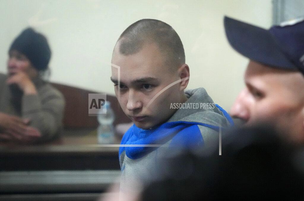Efrem Lukatsky Russian army Sergeant Vadim Shishimarin, 21, is seen behind a glass during a court hearing in Kyiv, Ukraine, Wednesday, May 18, 2022. The Russian soldier has gone on trial in Ukraine for the killing of an unarmed civilian. The case that opened in Kyiv marked the first time a member of the Russian military has been prosecuted for a war crime since Russia invaded Ukraine 11 weeks ago. (AP Photo/Efrem Lukatsky)