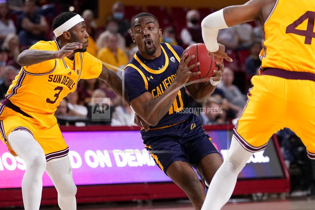 Matt York California guard Makale Foreman (10) drives as Arizona State guard Marreon Jackson (3) defends during the first half of an NCAA college basketball game, Thursday, March 3, 2022, in Tempe, Ariz. (AP Photo/Matt York)