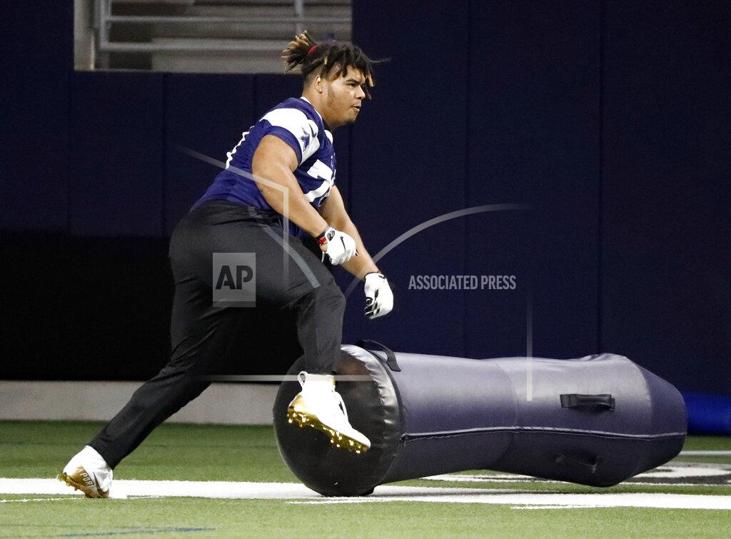 Tony Gutierrez Dallas Cowboys rookie defensive tackle Trysten Hill runs through a drill during the NFL football team's minicamp in Frisco, Texas, Friday, May 10, 2019. (AP Photo/Tony Gutierrez)