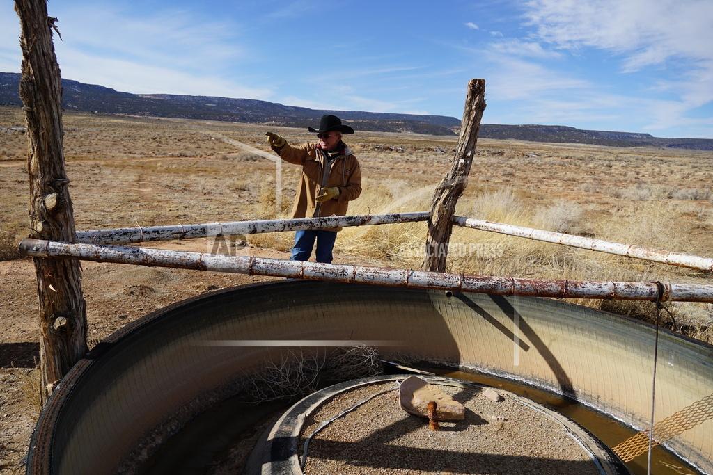 Zak Podmore Rancher Mike Wilcox shows off one of the livestock and wildlife guzzlers that's filled by a well for much of the year on his ranch in Lisbon Valley, Utah, on Nov. 12, 2020. Wilcox fears a copper mine's plans to pump diluted sulfuric acid into the shallow aquifer that supplies his well will drive him out of business. (Zak Podmore/The Salt Lake Tribune via AP)