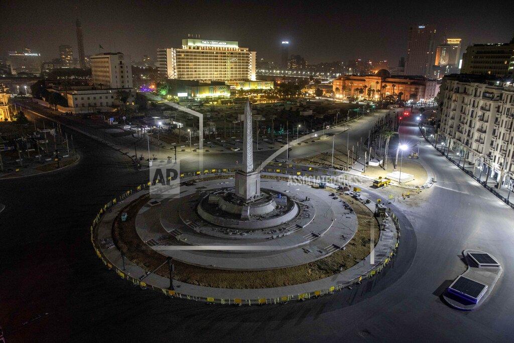 Nariman El-Mofty FILE - In this March 29, 2020 file photo, Tahrir Square, which was the focal point of the Jan. 25, 2011 Egyptian uprising that toppled autocrat Hosni Mubarak, is closed off by police during curfew hours as a prevention measures due to the coronavirus outbreak, in Cairo, Egypt. Even as Egyptian authorities fight the swelling coronavirus outbreak, security agencies have tried to stifle criticism about the handling of the health crisis by the government of President Abdel Fattah el-Sissi. (AP Photo/Nariman El-Mofty, File)