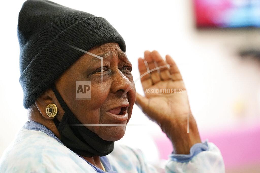 Rogelio V. Solis P.M. Browner, 88, speaks about her apprehension over receiving a COVID-19 vaccine while waiting for a transportation bus at the Rev. S.L.A. Jones Activity Center for the Elderly to take her and other seniors to the Aaron E. Henry Community Health Service Center to receive a vaccination, Wednesday, April 7, 2021, in Clarksdale, Miss. The Mississippi Department of Human Services is in the initial stages of teaming up with community senior services statewide to help older residents get vaccinated. (AP Photo/Rogelio V. Solis)