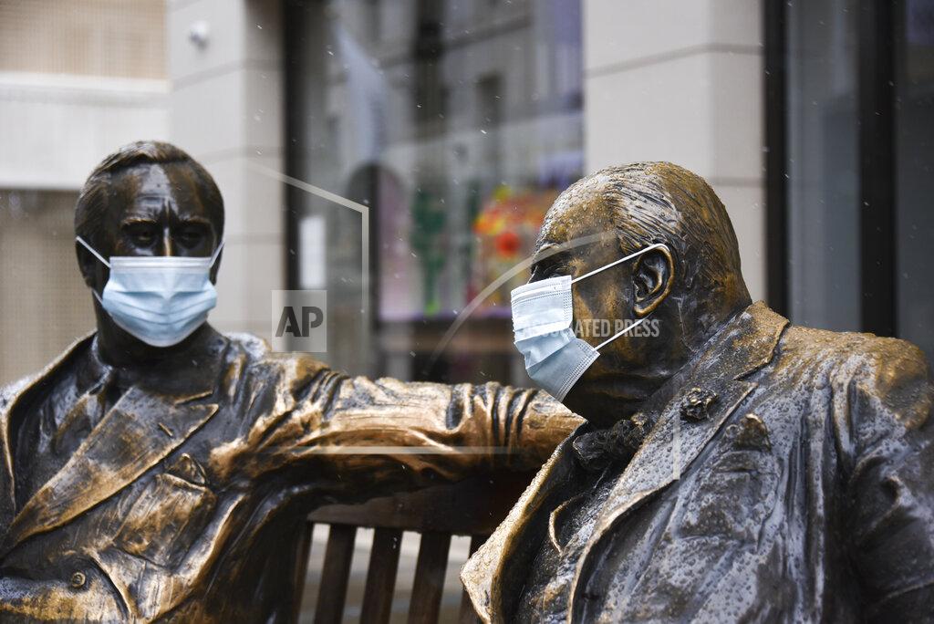 Alberto Pezzali Face coverings on the statues of former US President Franklyn D. Roosevelt, left, and former British Prime Minister Winston Churchill in Mayfair, London, Sunday, Feb. 7, 2021, as the third national lockdown, due to the COVID-19 outbreak, continues. (AP Photo/Alberto Pezzali)