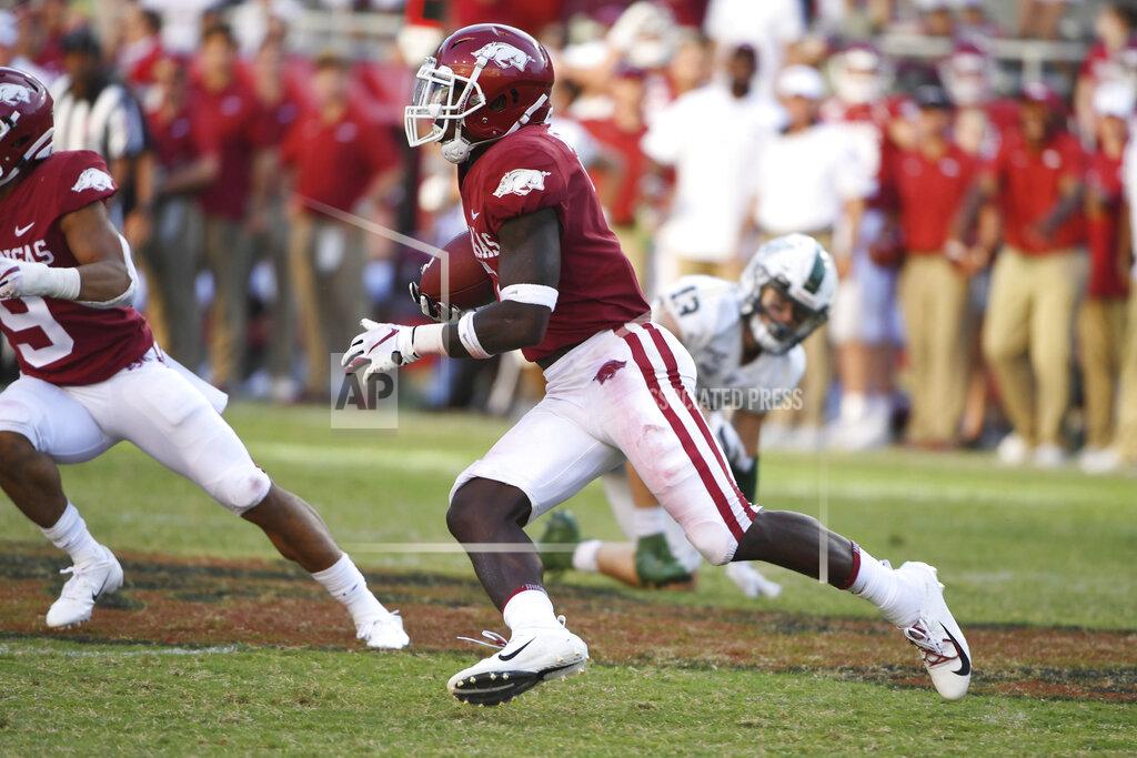 Michael Woods Arkansas defensive back Joe Foucha returns an interception of a Portland State pass during the second half of an NCAA college football game Saturday, Aug. 31, 2019 in Fayetteville, Ark. (AP Photo/Michael Woods)
