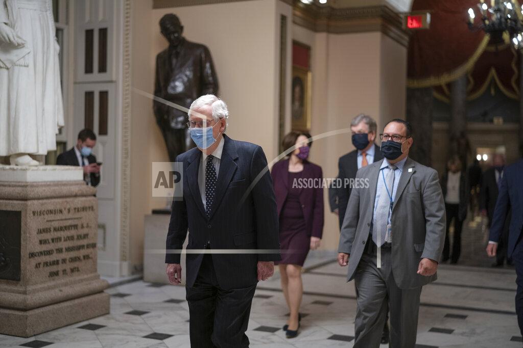 J. Scott Applewhite After violent protesters loyal to President Donald Trump stormed the U.S. Capitol today, Senate Majority Leader Mitch McConnell, R-Ky., returns to the House chamber to continue the joint session of the House and Senate and count the Electoral College votes cast in November's election, at the Capitol in Washington, Wednesday, Jan. 6, 2021. (AP Photo/J. Scott Applewhite)