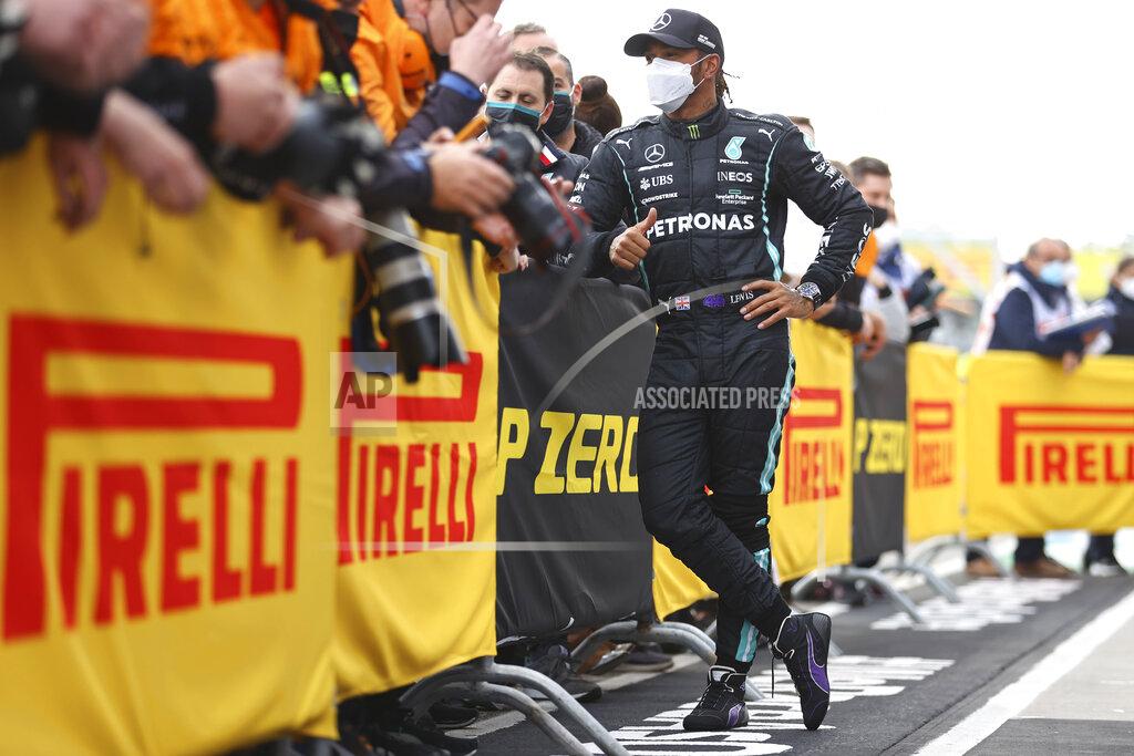 Bryn Lennon Second placed Mercedes Lewis Hamilton celebrates with teammates at the end of the Emilia Romagna Formula One Grand Prix, at the Imola racetrack, Italy, Sunday, April 18, 2021. (Bryn Lennon/ Pool Via AP)