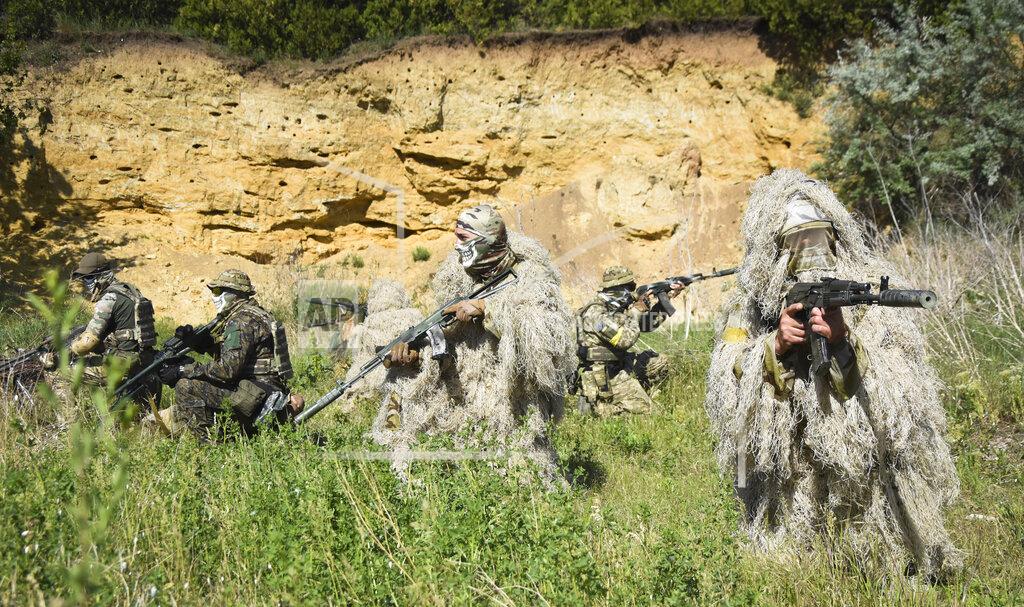 Max Pshybyshevsky Ukrainian Territorial Defence Forces members train on the outskirts of Odesa, Ukraine, Tuesday, May 24, 2022. (AP Photo/Max Pshybyshevsky)