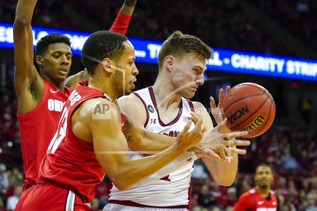 Andy Manis Ohio State's CJ Walker (13) fouls Wisconsin's Tyler Wahl, right, during the second half of an NCAA college basketball game Sunday, Feb. 9, 2020, in Madison, Wis. (AP Photo/Andy Manis)