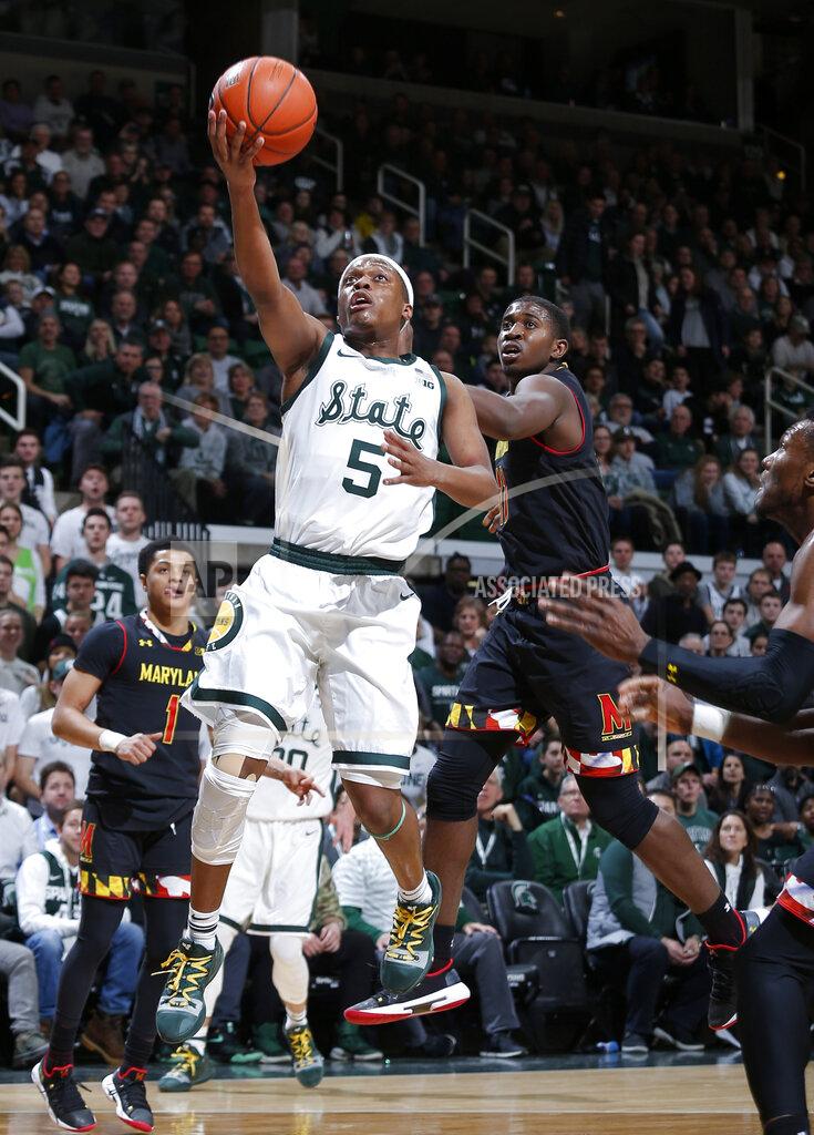 Al Goldis Michigan State's Cassius Winston, left, goes up for a layup against Maryland's Darryl Morsell during the first half of an NCAA college basketball game, Monday, Jan. 21, 2019, in East Lansing, Mich. (AP Photo/Al Goldis)