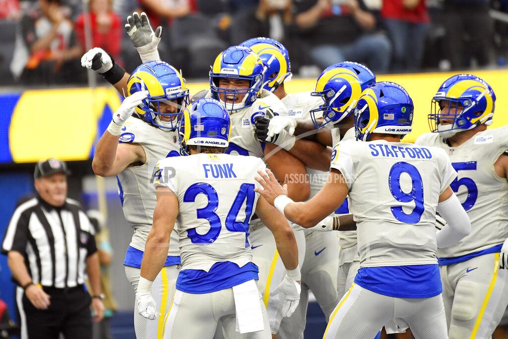 Kevork Djansezian Los Angeles Rams tight end Tyler Higbee, left, celebrates his touchdown catch with teammates during the first half of an NFL football game against the Tampa Bay Buccaneers Sunday, Sept. 26, 2021, in Inglewood, Calif. (AP Photo/Kevork Djansezian)