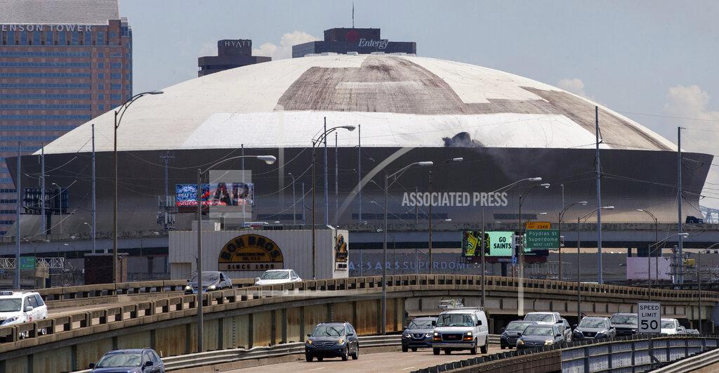 David Grunfeld A top front section of the Caesars Superdome roof is charred black after the dome caught fire in New Orleans, Tuesday, Sept. 21, 2021. (David Grunfeld/The Times-Picayune/The New Orleans Advocate via AP)