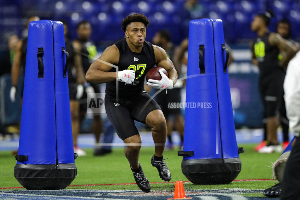 Michael Conroy Wisconsin running back Jonathan Taylor runs a drill at the NFL football scouting combine in Indianapolis, Friday, Feb. 28, 2020. (AP Photo/Michael Conroy)