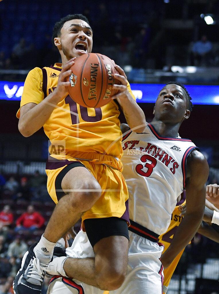 Jessica Hill Arizona State's Jaelen House goes up for a basket as St. John's Rasheem Dunn, right, defends during the first half of an NCAA college basketball game, Saturday, Nov. 23, 2019, in Uncasville, Conn. (AP Photo/Jessica Hill)