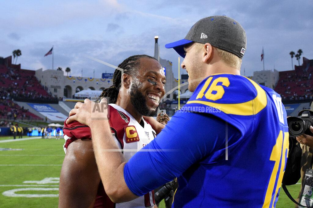Mark J. Terrill Arizona Cardinals wide receiver Larry Fitzgerald, left, greets Los Angeles Rams quarterback Jared Goff after an NFL football game Sunday, Dec. 29, 2019, in Los Angeles. (AP Photo/Mark J. Terrill)
