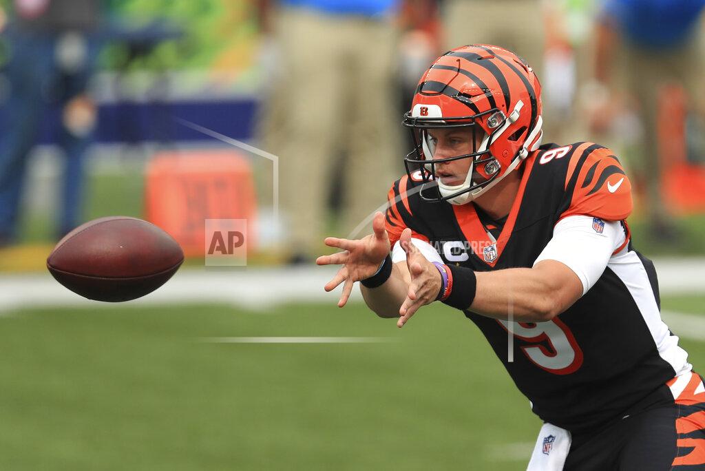 Aaron Doster Cincinnati Bengals quarterback Joe Burrow (9) tosses the football during the first half of an NFL football game against the Los Angeles Chargers, Sunday, Sept. 13, 2020, in Cincinnati. (AP Photo/Aaron Doster)