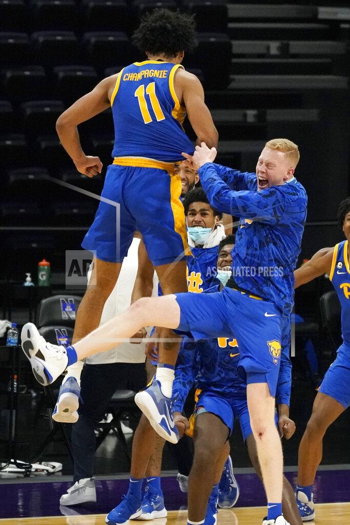 Nam Y. Huh Pittsburgh's Justin Champagnie (11) celebrates with teammates after Pittsburgh defeated Northwestern in an NCAA college basketball game in Evanston, Ill., Wednesday, Dec. 9, 2020. (AP Photo/Nam Y. Huh)