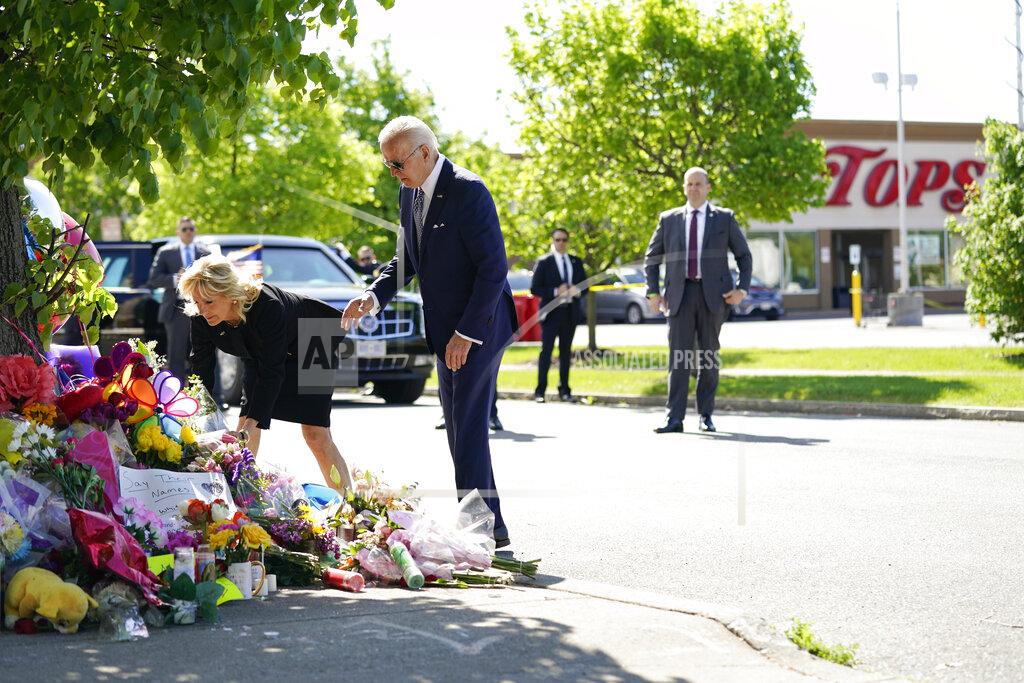 Andrew Harnik President Joe Biden and first lady Jill Biden visit the scene of a shooting at a supermarket to pay respects and speak to families of the victims of Saturday's shooting in Buffalo, N.Y., Tuesday, May 17, 2022. (AP Photo/Andrew Harnik)