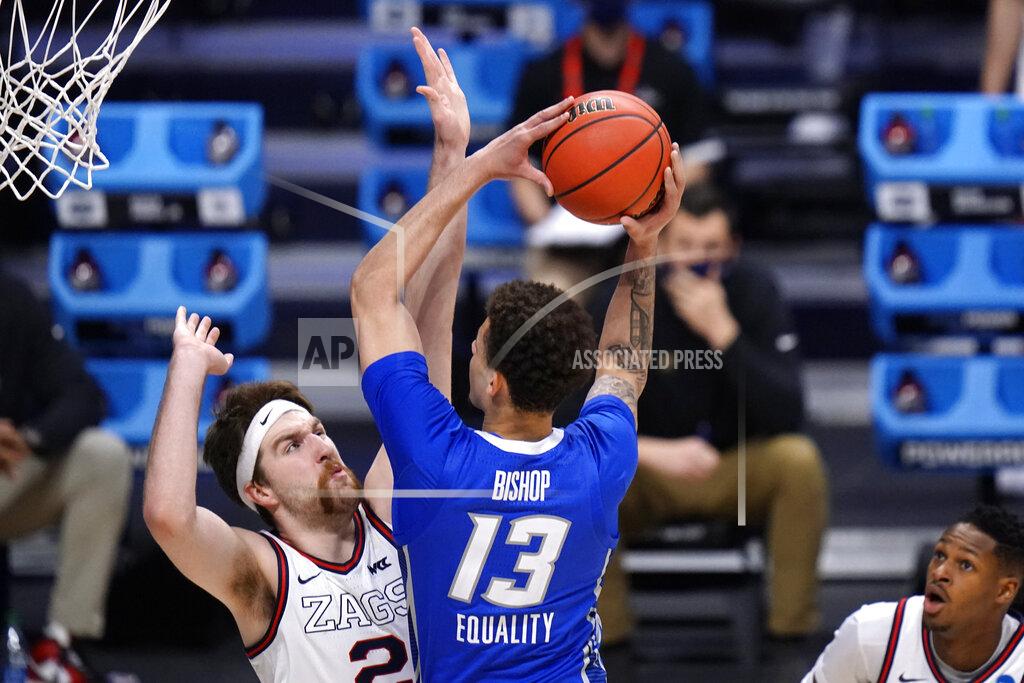Aj Mast Creighton forward Christian Bishop (13) drives on Gonzaga forward Drew Timme (2) in the first half of a Sweet 16 game in the NCAA men's college basketball tournament at Hinkle Fieldhouse in Indianapolis, Sunday, March 28, 2021. (AP Photo/AJ Mast)