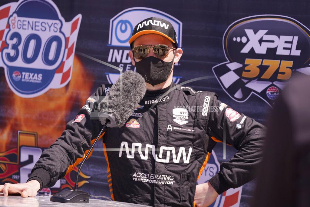 Lm Otero Pato O'Ward of Mexico speaks to reporters after driving during IndyCar auto race testing at Texas Motor Speedway in Fort Worth, Texas, Wednesday, March 31, 2021. (AP Photo/LM Otero)