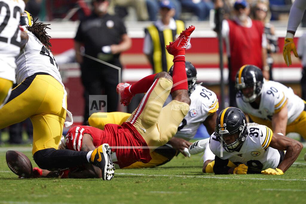 Tony Avelar San Francisco 49ers running back Raheem Mostert, bottom left, fumbles the ball in front of Pittsburgh Steelers free safety Minkah Fitzpatrick (39) during the first half of an NFL football game in Santa Clara, Calif., Sunday, Sept. 22, 2019. (AP Photo/Tony Avelar)