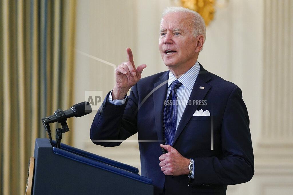 Evan Vucci President Joe Biden takes questions from reporters as he speaks about the COVID-19 vaccination program, in the State Dining Room of the White House, Tuesday, May 4, 2021, in Washington. (AP Photo/Evan Vucci)