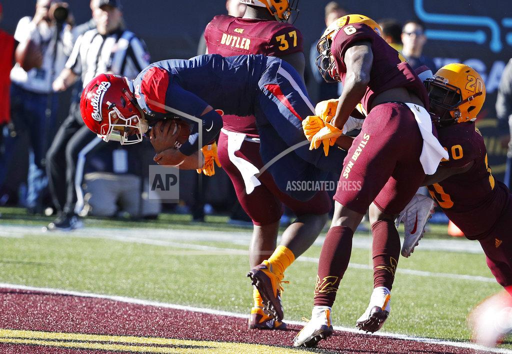 John Locher Fresno State quarterback Marcus McMaryion (6) dives into the end zone for a touchdown against Arizona State during the first half of the Las Vegas Bowl NCAA college football game, Saturday, Dec. 15, 2018, in Las Vegas. (AP Photo/John Locher)