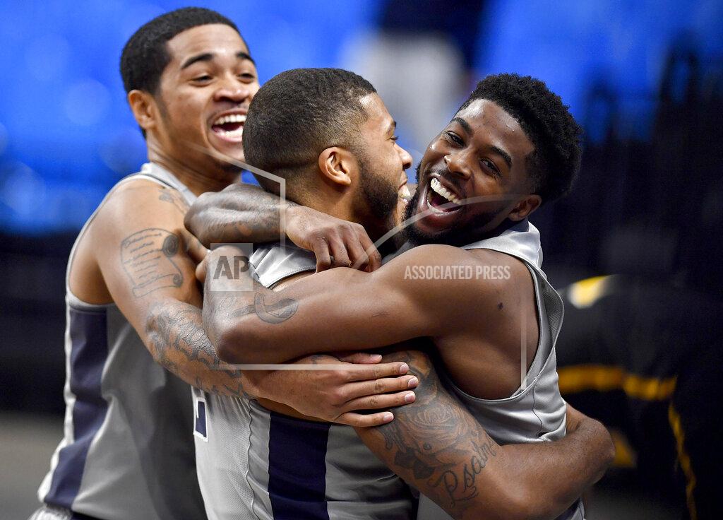 Abby Drey Penn State's Myles Dread is hugged by teammate Jamari Wheeler after his buzzer-beater for the win over VCU during an NCAA college basketball game Wednesday, Dec. 2, 2020, in State College, Pa. (Abby Drey/Centre Daily Times via AP)