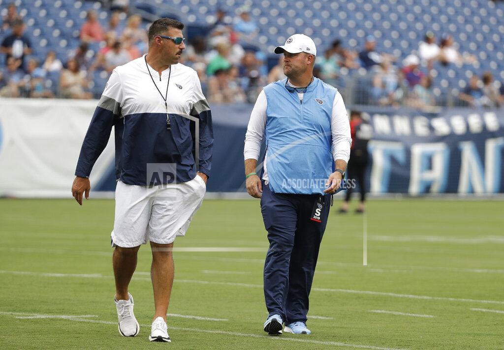 Mark Humphrey FILE - In this Aug. 3, 2019, file photo, Tennessee Titans coach Mike Vrabel, left, and general manager Jon Robinson walk on the field before a practice in Nissan Stadium during NFL football training camp in Nashville, Tenn. Robinson, hired in January 2016 to rebuild a team that won five games combined the previous two seasons, finds himself needing to retool the roster for Vrabel. “We have to add pieces to the team," Robinson said. "We have a lot of good football players on this football team that have bought into the philosophy of how we want to play the game, to the culture that we have here in Nashville, and we've got to continue to add pieces to this core.” (AP Photo/Mark Humphrey, File)