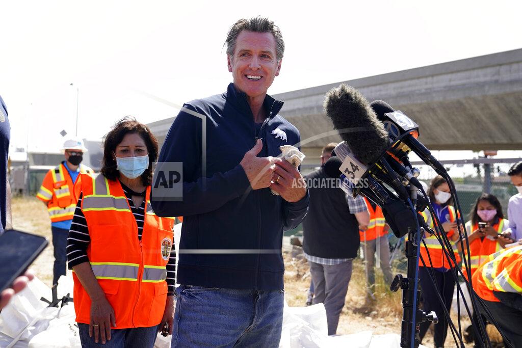 Marcio Jose Sanchez California Gov. Gavin Newsom fields questions Tuesday, May 11, 2021, in Los Angeles. Newsom on Tuesday proposed $12 billion in new funding to get more people experiencing homelessness in the state into housing and to "functionally end family homelessness" within five years. (AP Photo/Marcio Jose Sanchez)
