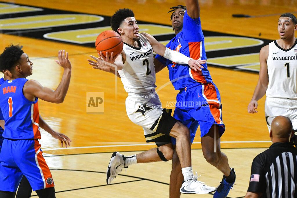 John Amis Vanderbilt guard Scotty Pippen Jr. (2) goes up to shoot as Florida forward Omar Payne defends during the first half of an NCAA college basketball game Wednesday, Dec. 30, 2020, in Nashville, Tenn. (AP Photo/John Amis)