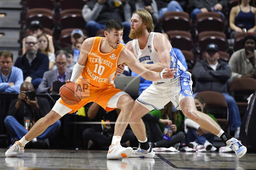 Jessica Hill Tennessee's John Fulkerson (10) is guarded by North Carolina's Brady Manek (45) in the second half of an NCAA college basketball game, Sunday, Nov. 21, 2021, in Uncasville, Conn. (AP Photo/Jessica Hill)
