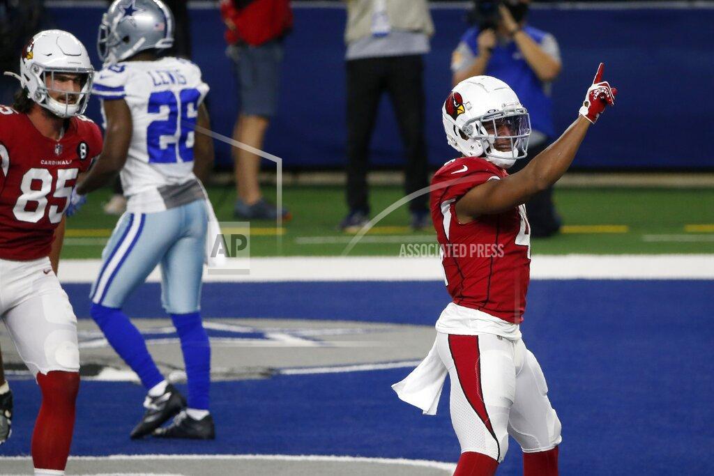 Michael Ainsworth Arizona Cardinals' Dan Arnold (85) runs to join Kenyan Drake (41) who celebrates after carrying the ball for a touchdown in the first half of an NFL football game as Dallas Cowboys' Jourdan Lewis (26) walks away in Arlington, Texas, Monday, Oct. 19, 2020. (AP Photo/Michael Ainsworth)