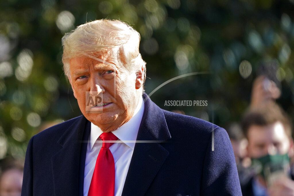 Gerald Herbert FILE - President Donald Trump walks to board Marine One on the South Lawn of the White House on Jan. 12, 2021, in Washington. A judge has rejected a request by lawyers for former President Trump to delay progression of a defamation lawsuit while an appeals court decides if the United States can be substituted as the defendant. Judge Lewis A. Kaplan in Manhattan federal court issued a brief denial Wednesday, Sept. 15, 2021, of the request. (AP Photo/Gerald Herbert, File )