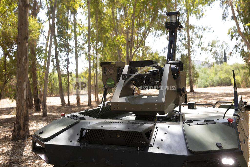 Sebastian Scheiner Israel Aerospace Industries' semi-autonomous four-wheel-drive "REX MKII" is seen at an IAI facility near the central Israeli city of Lod, Thursday, Sept. 9, 2021. Israel's state-owned Israel Aerospace Industries unveiled Monday a state-of-the-art unmanned vehicle their specialists said will be deployed alongside ground troops to assist in combat situations. (AP Photo/Sebastian Scheiner)