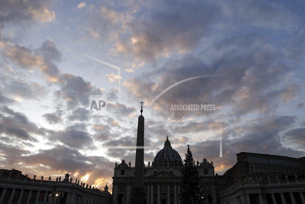 Gregorio Borgia FILE - The sun sets behind St. Peter's Basilica, at the Vatican, Thursday, Dec. 5, 2019. The Vatican’s sprawling financial trial may not have produced any convictions yet or any new smoking guns. But recent testimony in May 2022 has provided plenty of insights into how the Vatican operates. (AP Photo/Gregorio Borgia, File)