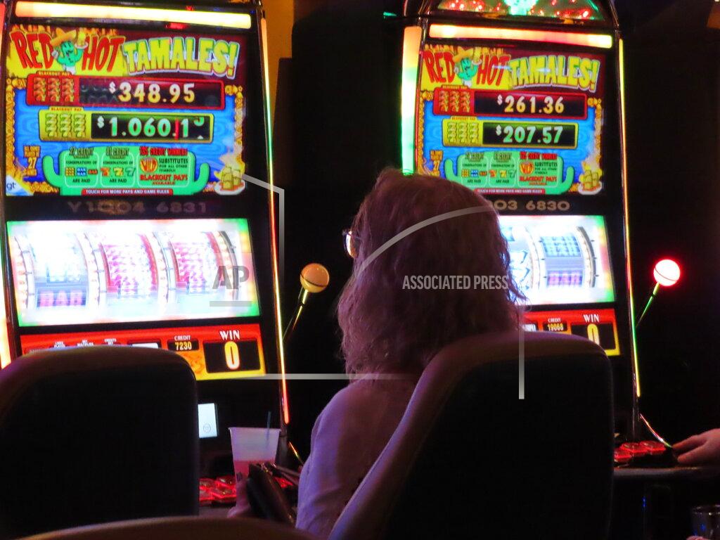 Wayne Parry A gambler plays a slot machine at the Tropicana casino in Atlantic City, N.J., on May 12, 2022. Figures released by New Jersey gambling regulators on May 23, 2022, show the Atlantic City casinos collectively posted a gross operating profit of $155.6 million in the first quarter of this year. (AP Photo/Wayne Parry)