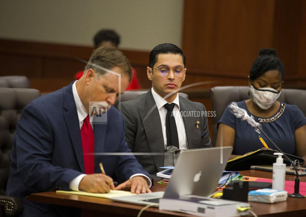 Godofredo A. Vásquez Attorney Michael Elliott and his client Victor Hugo Cuevas, a 26-year-old linked to a missing tiger named India, attend a bond revocation hearing on a separate murder charge at Fort Bend County Justice Center on Friday, May 14, 2021, in Richmond, Texas. (Godofredo A. Vásquez/Houston Chronicle via AP)