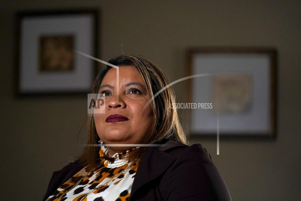 Jeff Roberson Irma Chavez poses for a photo, Tuesday, March 9, 2021, in Springdale, Ark. Chavez came to the United States from her home in El Salvador in 1994 when she was 18 and later was granted temporary protected status. (AP Photo/Jeff Roberson)