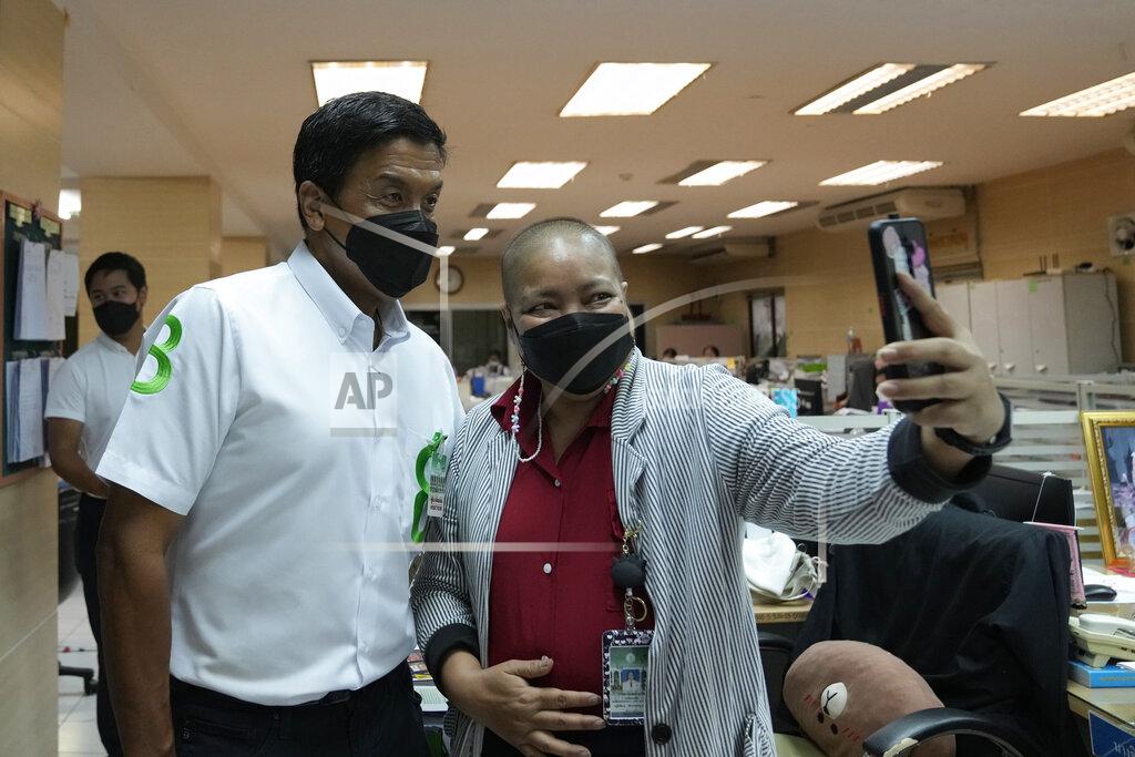 Sakchai Lalit A supporter takes a selfie with Bangkok governor independent candidate Chadchart Sittipunt, left, during an election campaign in Bangkok, Thailand Tuesday, May 17, 2022. Residents of the Thai capital Bangkok will cast their ballots for the city’s leader Sunday in a vote seen as a barometer of the public mood ahead of an approaching general election. (AP Photo/Sakchai Lalit)